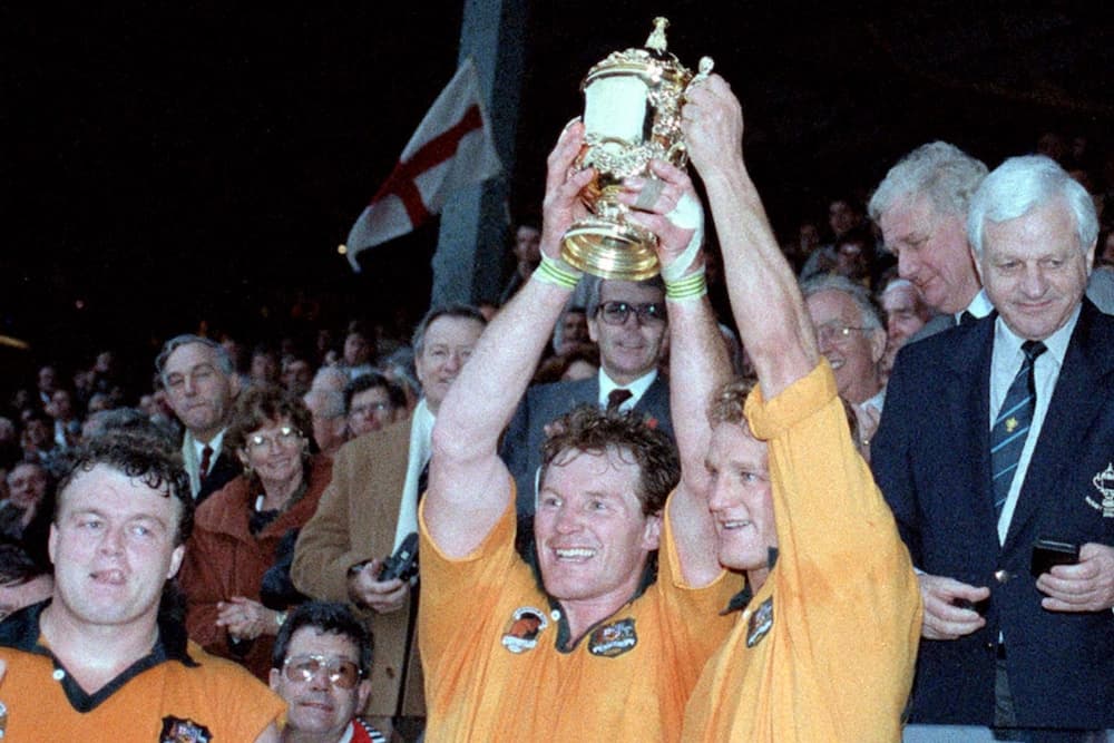 Tony Daly, Simon Poidevin and Michael Lynagh celebrating being crowd World Champions. Photo: Getty Images