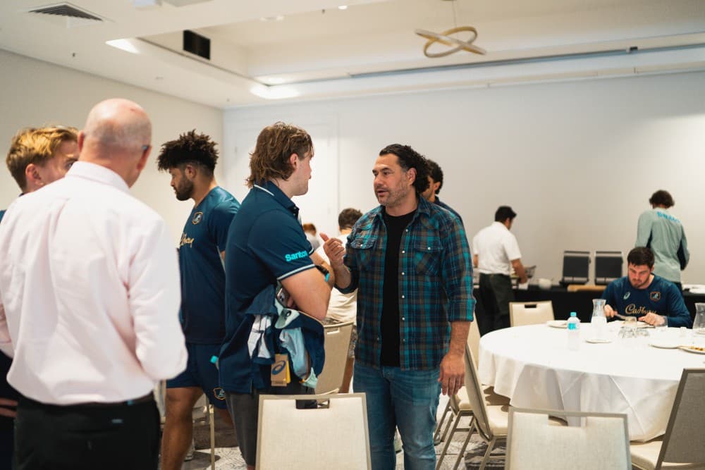 Flanker royalty George Smith passing down advice to current star Fraser McReight as  Wallabies legends ducked into camp to inspire the side before Wales. Photo: Julius Dimataga/Wallabies Media